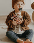 Puppy with striped sweater